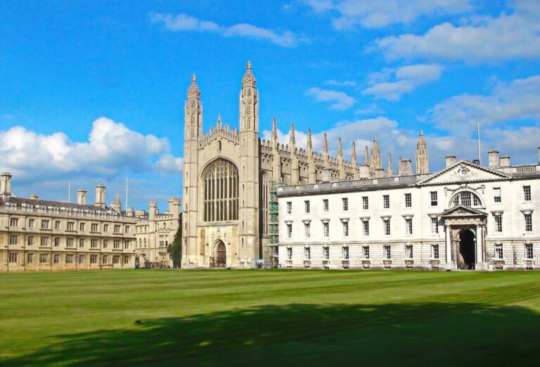 Group walking tour passing King's College, Cambridge